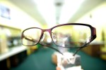 Strange perspective on glasses with blurred background.