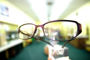 Strange perspective on glasses with blurred background.